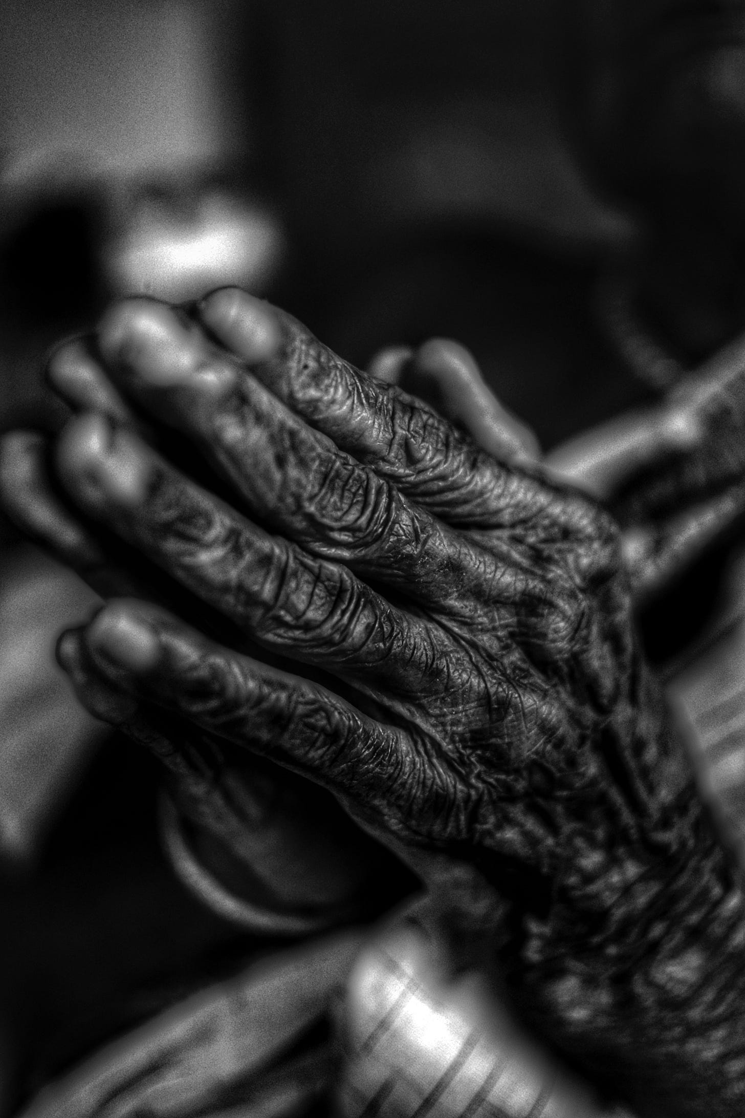Aged praying hands