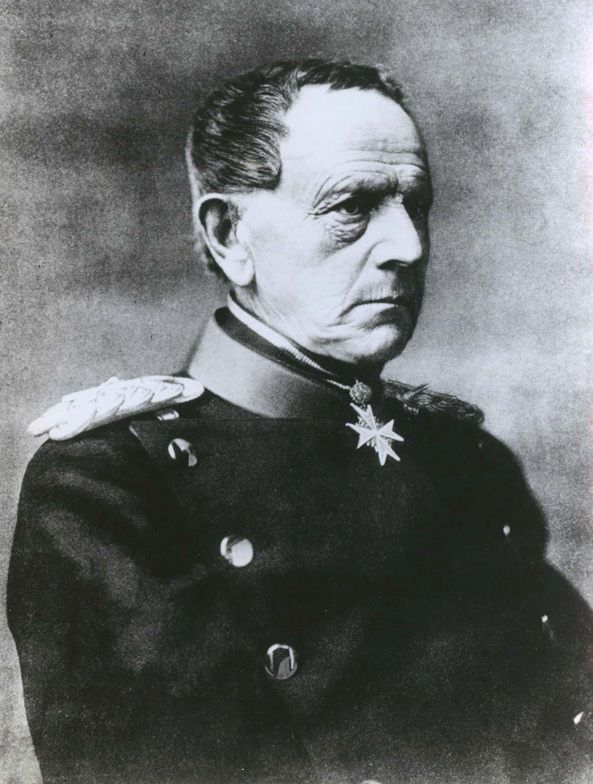 Field Marshal Helmuth von Moltke the Elder's photographic portrait. An ugly, sour man glowers into the distance. 