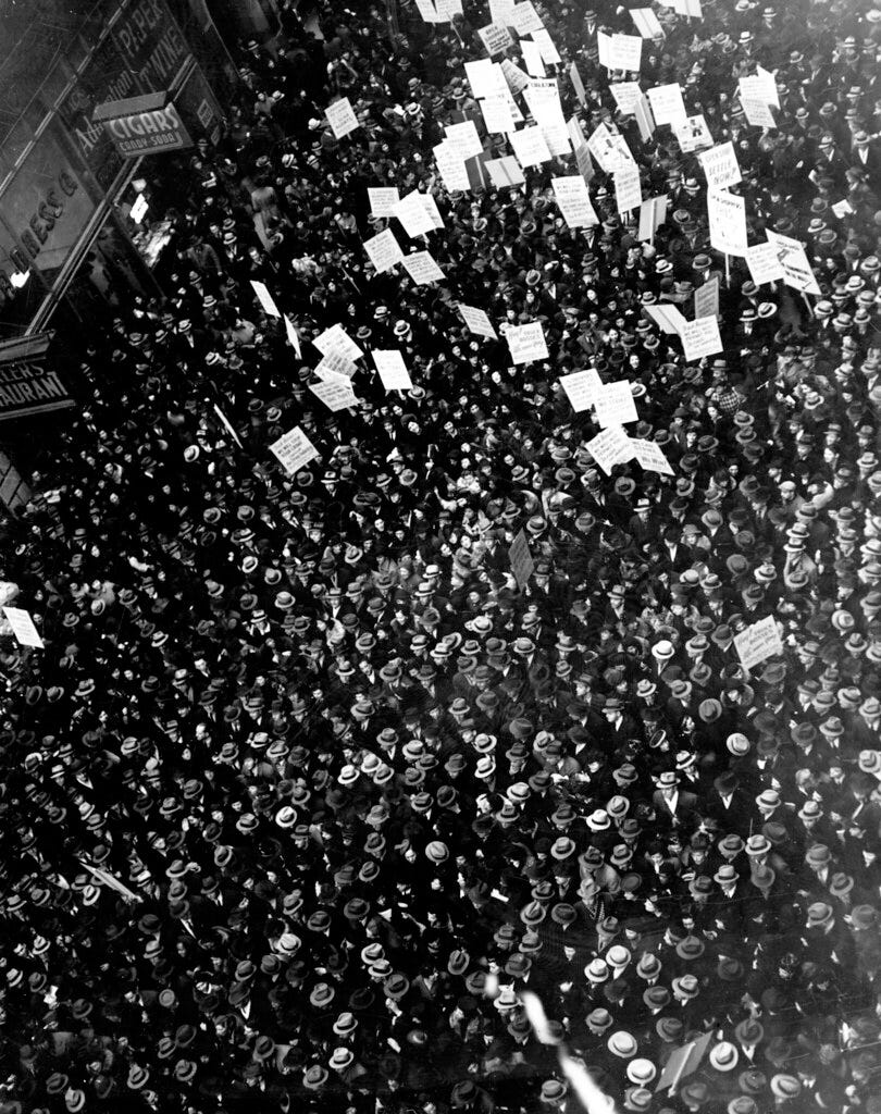 "Crowds fill the street during the New York Dressmakers Strike of 1933." by Kheel Center, Cornell University Library is licensed under CC BY 2.0.  