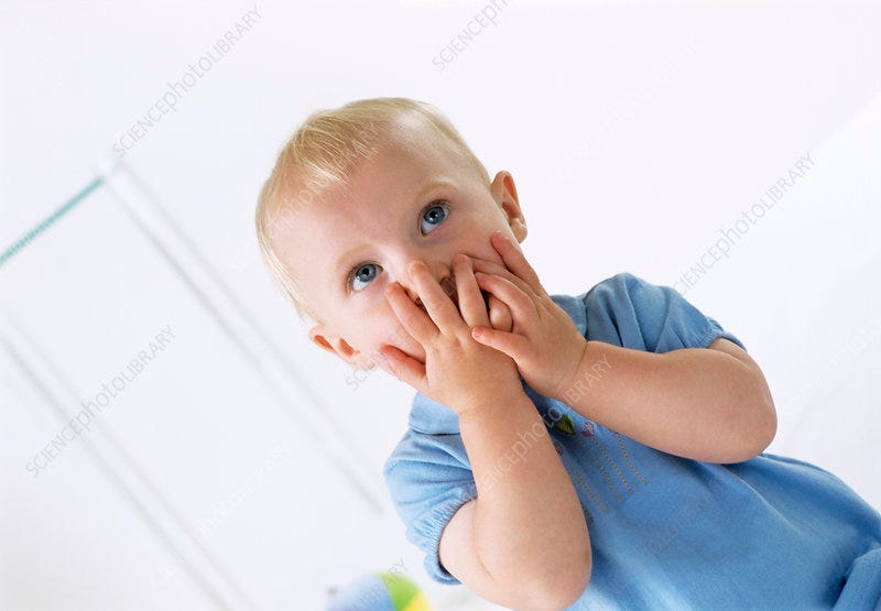 Young child looking guilty - Stock Image - M830/1402 - Science Photo Library