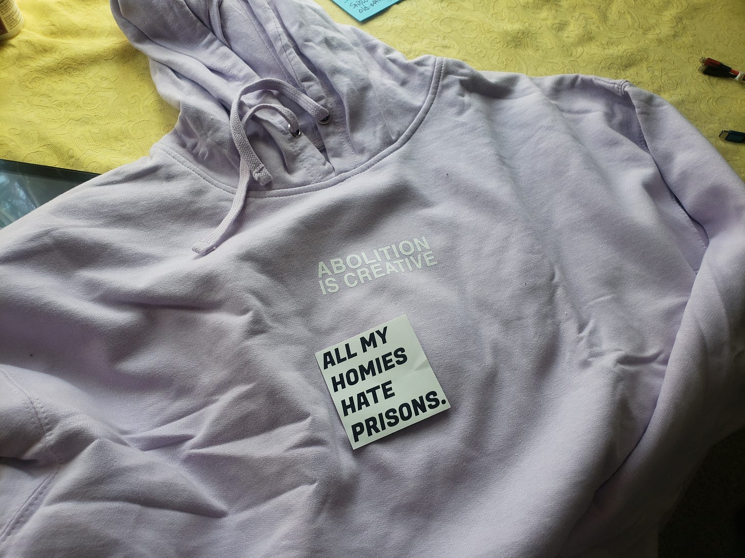 lavendar hoodie with the text "Abolition is creative"