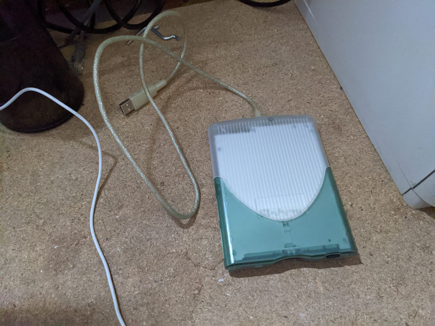 A USB floppy disk drive, on a desk. A USB floppy disk drive, on a desk.