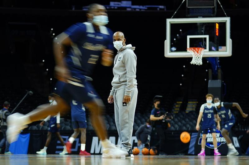 Saint Peter's head coach Shaheen Holloway watches practice for the NCAA men's college basketball tournament, Thursday, March 24, 2022, in Philadelphia. Saint Peter's plays Purdue in a Sweet 16 game on Friday. (AP Photo/Matt Rourke)