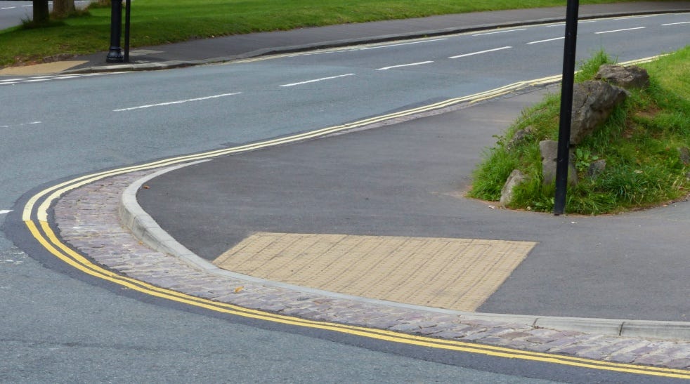 Dropped kerb with tactile paving within a visually sensitive area