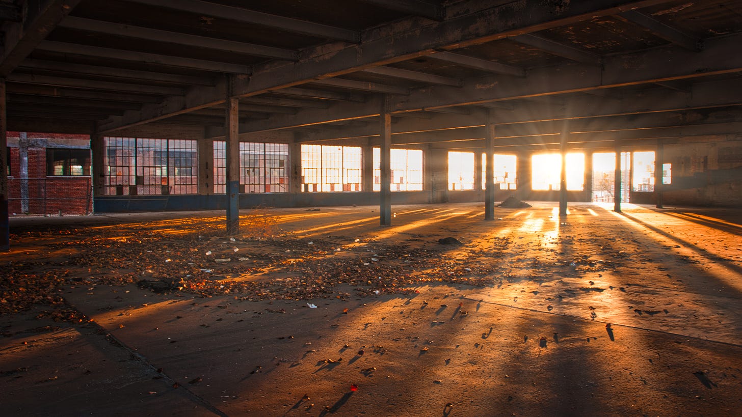 Sunshine coming through a window into a deserted warehouse.