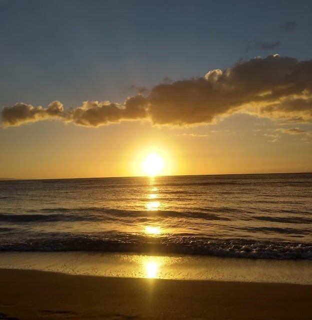 The sun sets over Maui
