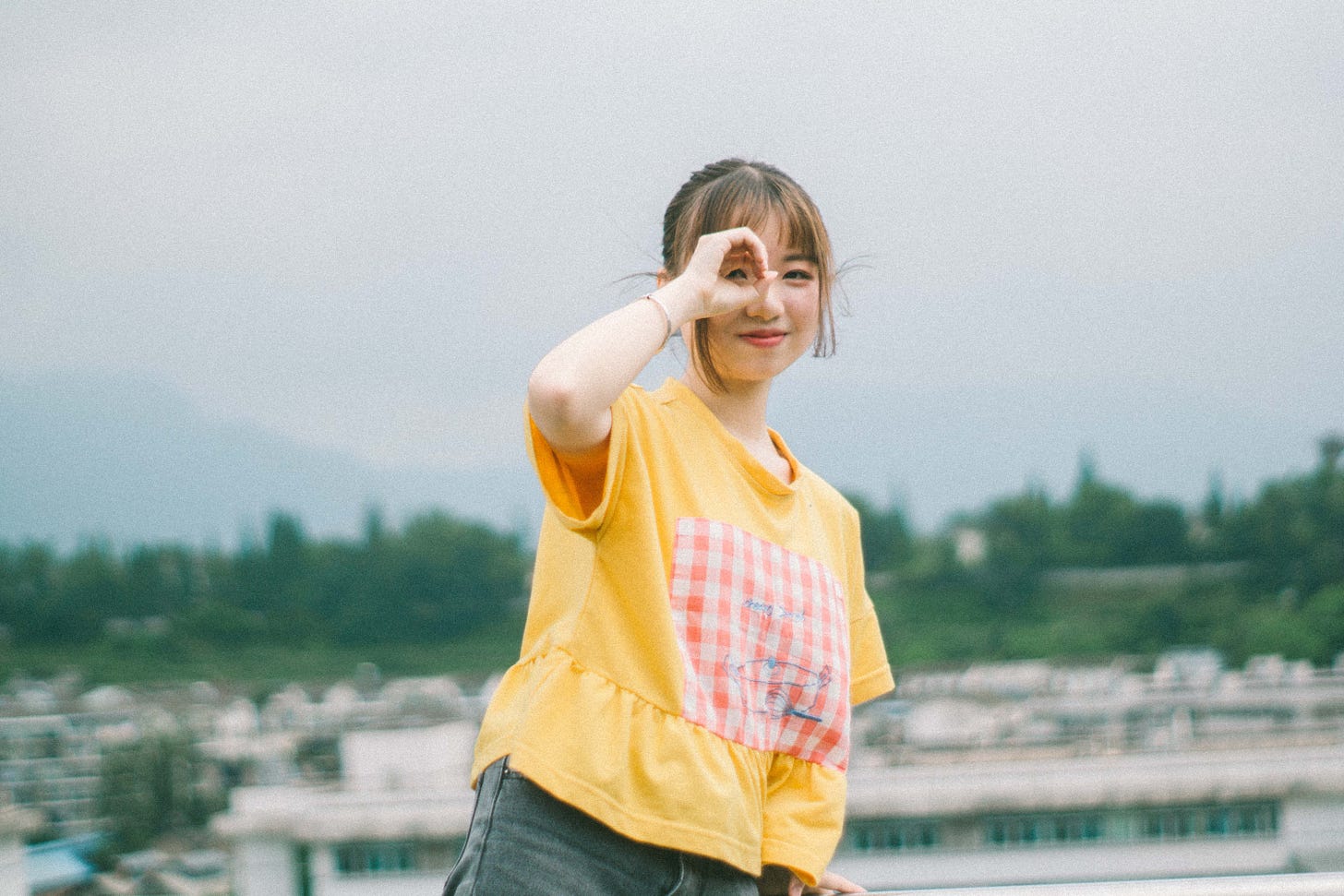 selective focus photography of woman wearing beige crew neck t-shirt photo