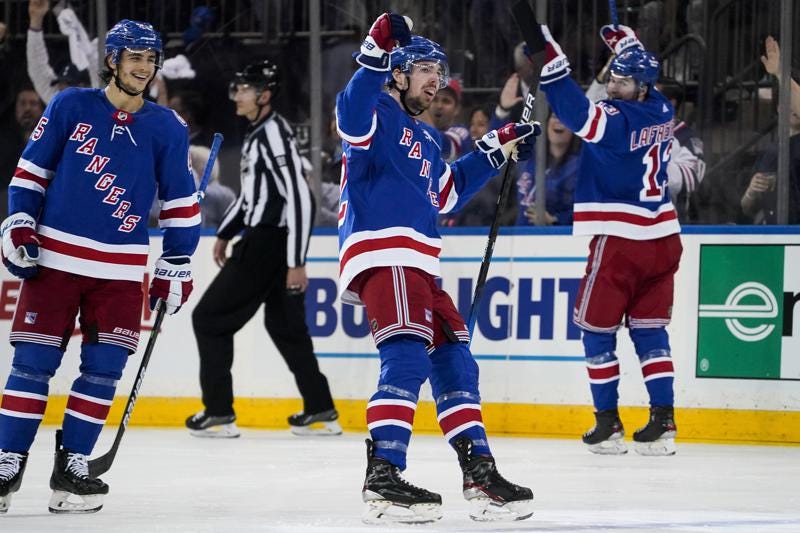 New York Rangers center Filip Chytil (72) celebrates after scoring on Carolina Hurricanes goaltender Antti Raanta during the second period of Game 6 of an NHL hockey Stanley Cup second-round playoff series, Saturday, May 28, 2022, in New York. (AP Photo/John Minchillo)