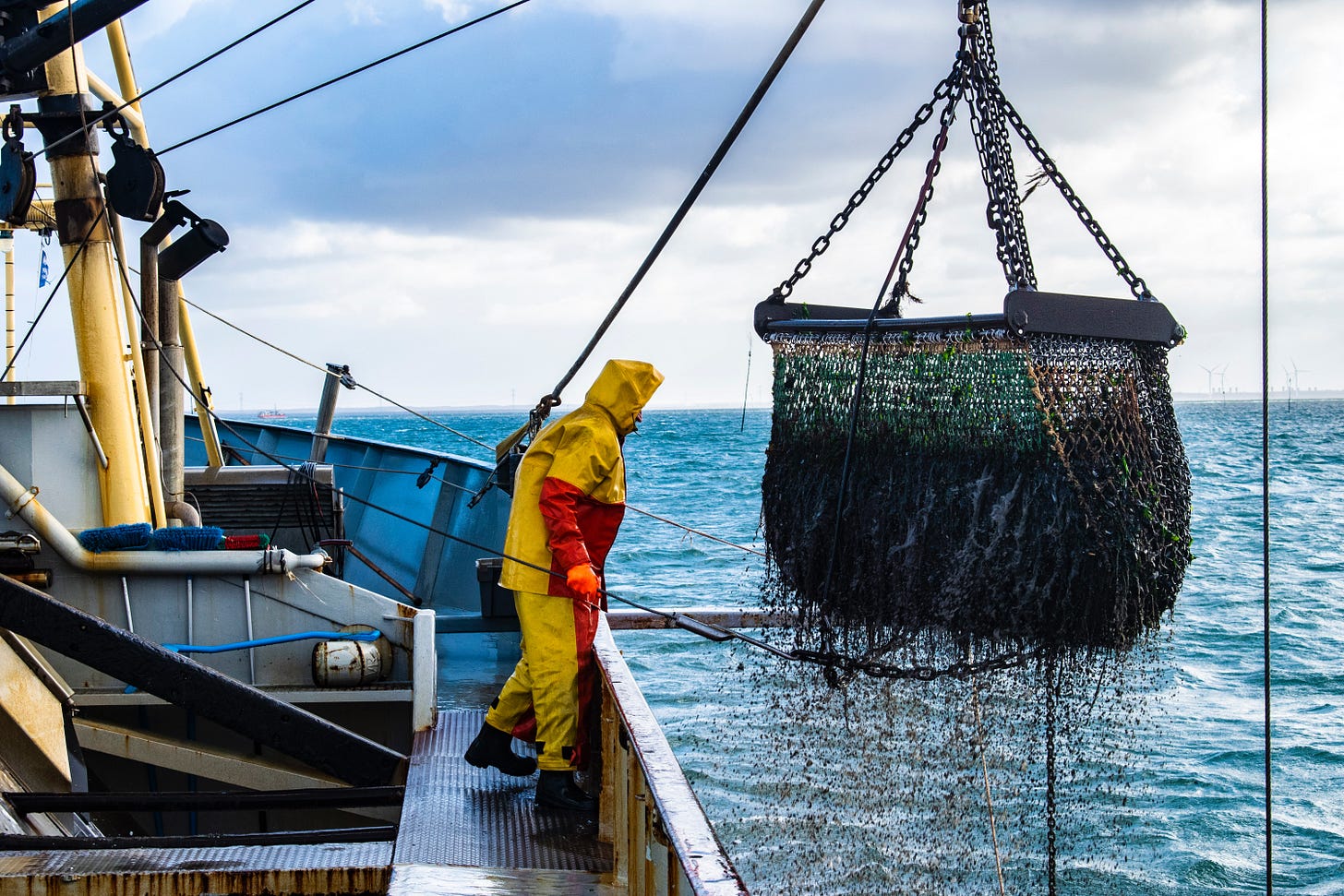 Fishermen hauling up catch