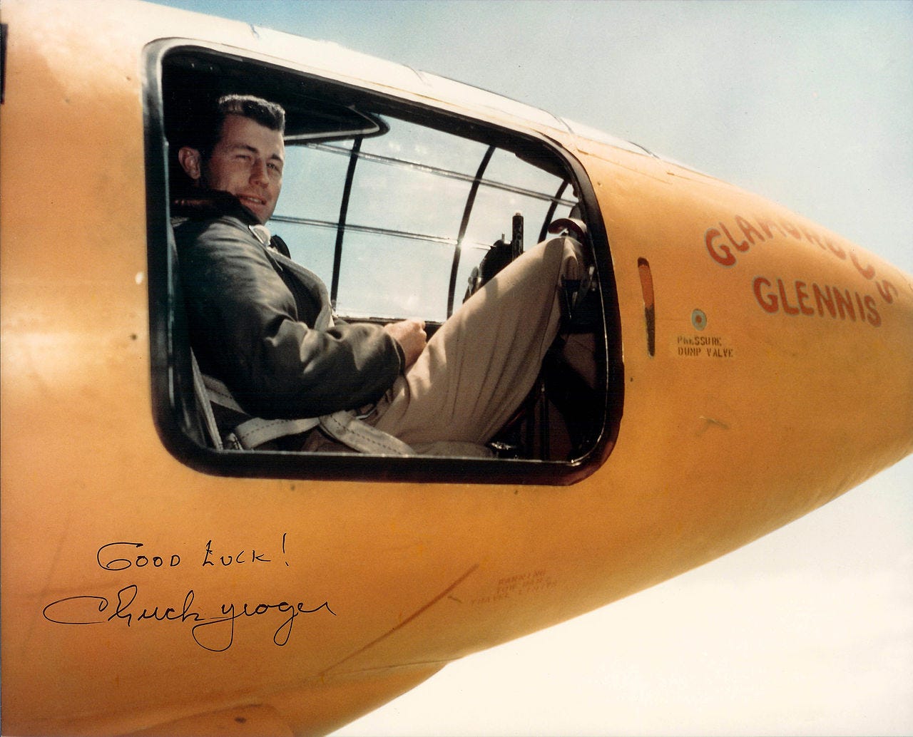 A man in the cockpit of a plane
