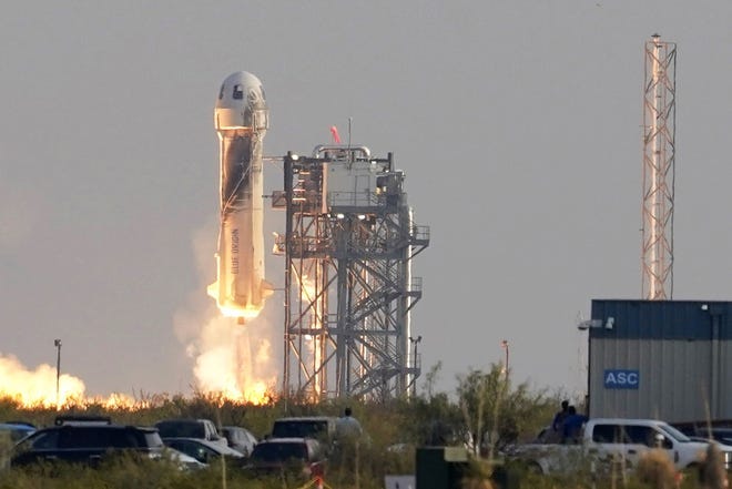 Blue Origin's New Shepard rocket launches carrying passengers Jeff Bezos, founder of Amazon and space tourism company Blue Origin, brother Mark Bezos, Oliver Daemen and Wally Funk, from its spaceport near Van Horn, on July 20. [AP PHOTO/TONY GUTIERREZ/FILE]