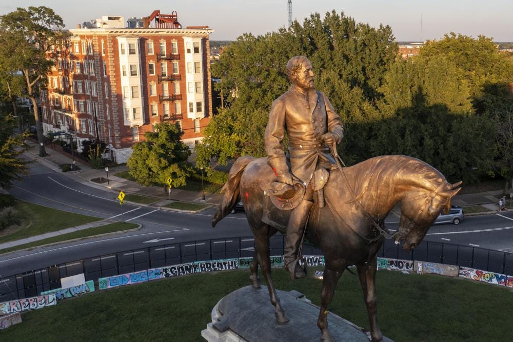 The statue of Confederate Gen. Robert E. Lee is bathed in the late sun on Monument Avenue in Richmond, Va., Monday, Sept. 6, 2021. The statue is scheduled to be removed by the state Wednesday, Sept. 8 after a ruling by the Virginia Supreme Court. (AP Photo/Steve Helber)