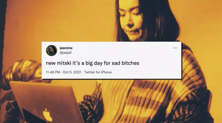 Mitski with a screenshot of a tweet that says "new mitski it's a big day for sad bitches"