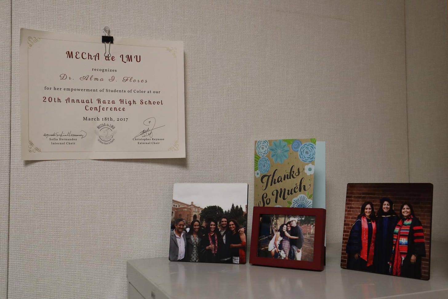 Sacramento State’s education assistant professor Alma Flores hangs an award from Loyola Marymount University’s Movimiento Estudiantil Chicanx de Aztlán that recognizes her for her empowerment of students of color. Flores said that not only does Sac State need to hire more faculty of color, but the retention of that faculty is just as important.