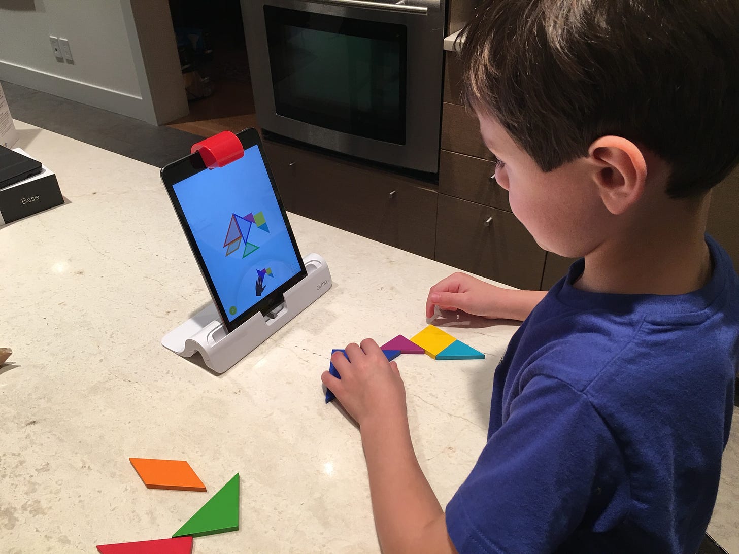 Our 5 year old playing tangram