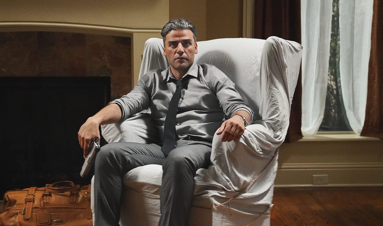 Oscar Isaac sitting down