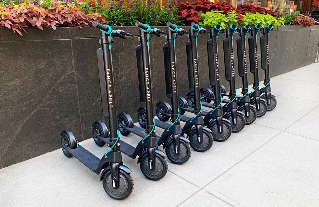 A row of scooters

Description automatically generated with low confidence