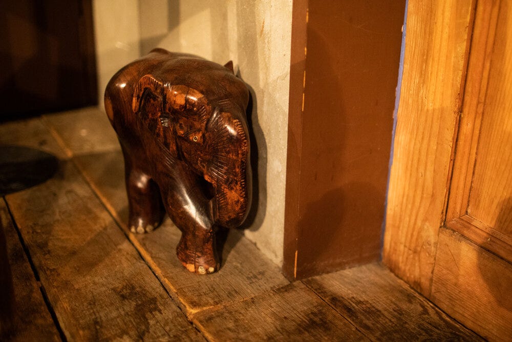 A wooden elephant guards the front door of Elephant Factory.