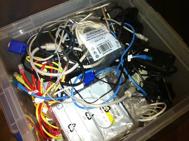 Photo of cables and and other old gear in a box