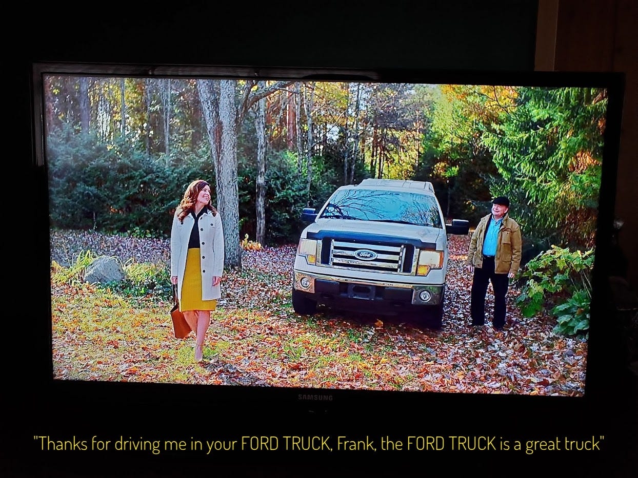 Katie and Frank in Paige's yard, lovingly framing Frank's Ford truck, captioned "thanks for driving me in your FORD TRUCK, Frank, the FORD TRUCK is a great truck"