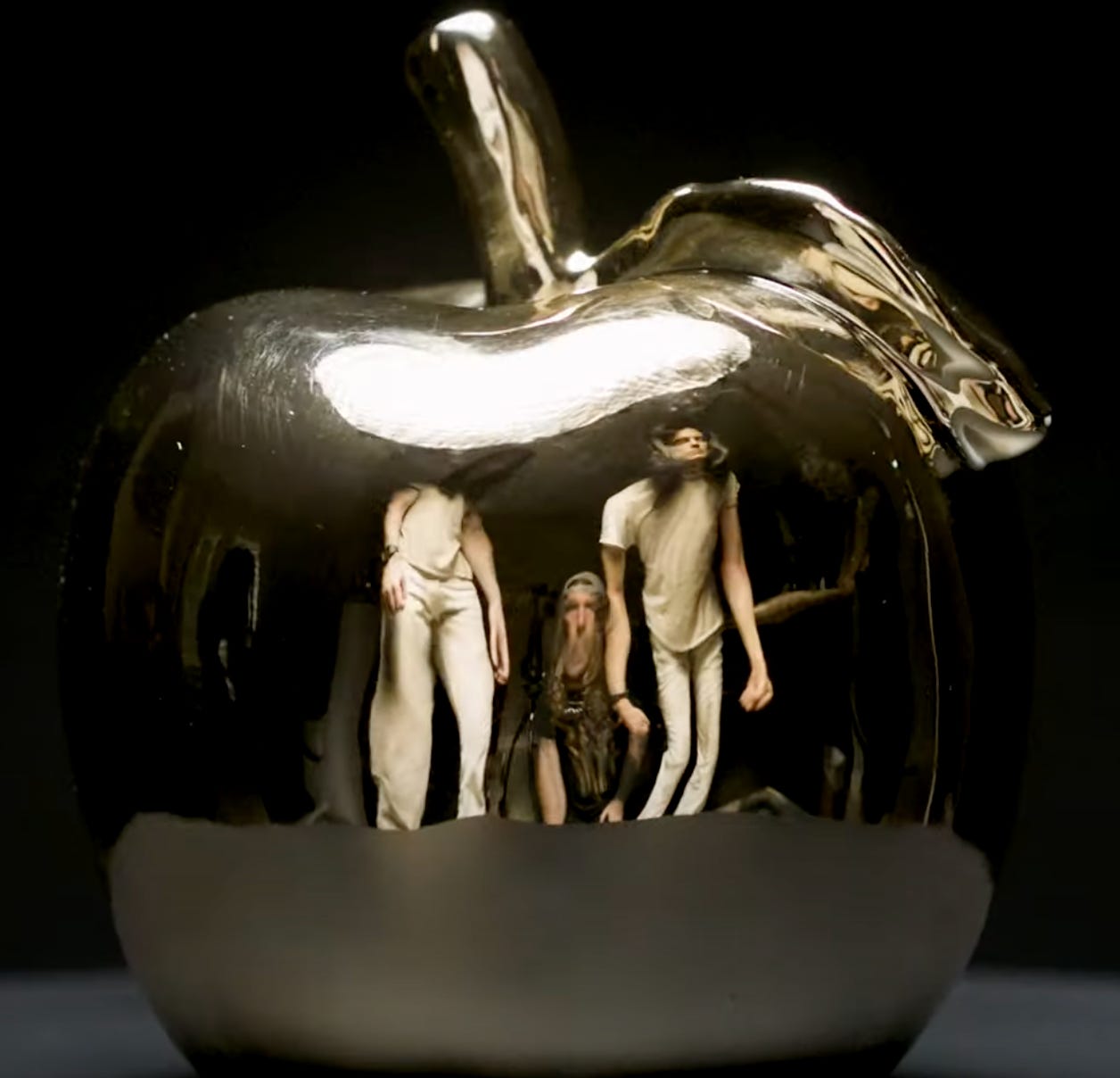 A shot of the reflective golden apple from Andrew WK's Babalon video