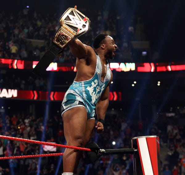 Big E celebrates with the WWE title belt