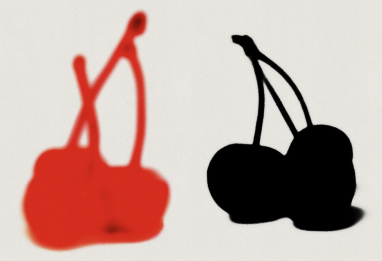 Two silhouettes of cherries(?). One red, the other black