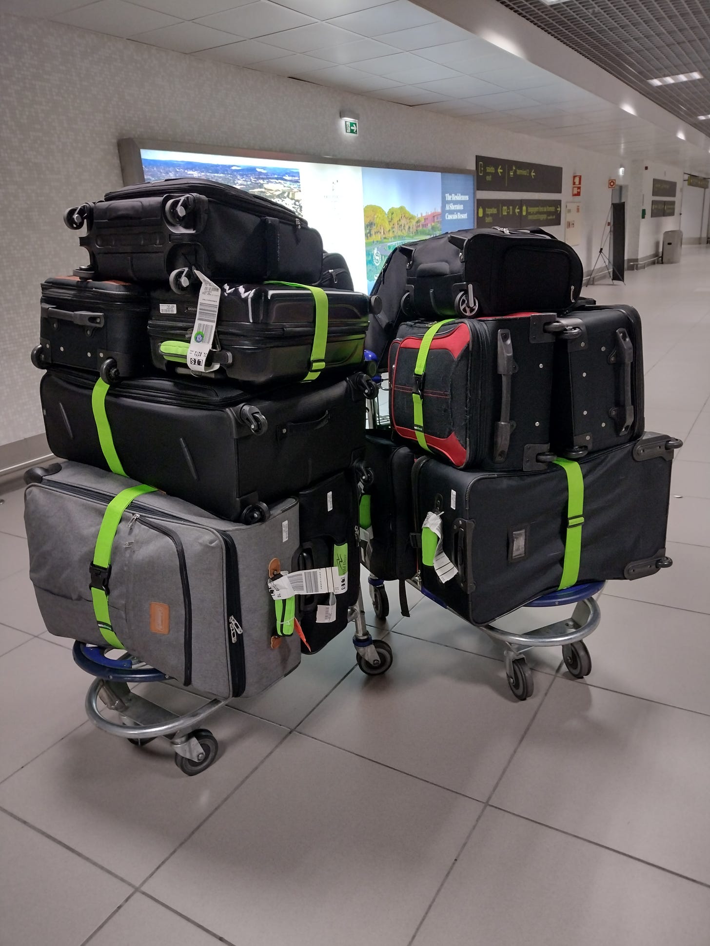 Suitcases piled in the airport
