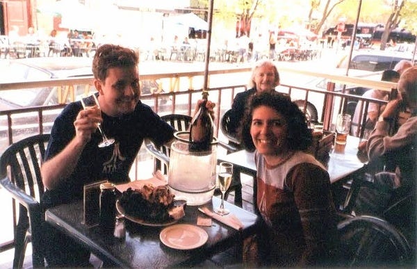 (Pictured: Author as young man with young wife enjoying wings and Dom Pérignon)