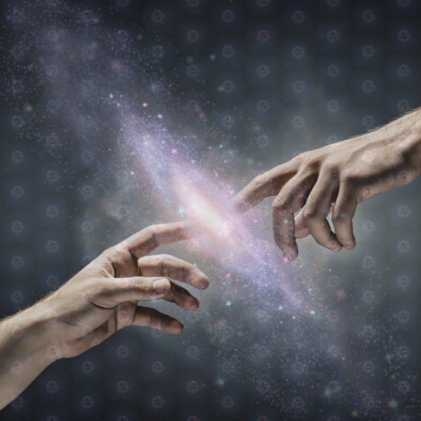 A pair of hands touch. Between their index fingers is an image of the Milky Way galaxy overlaid with barely-visible atoms.