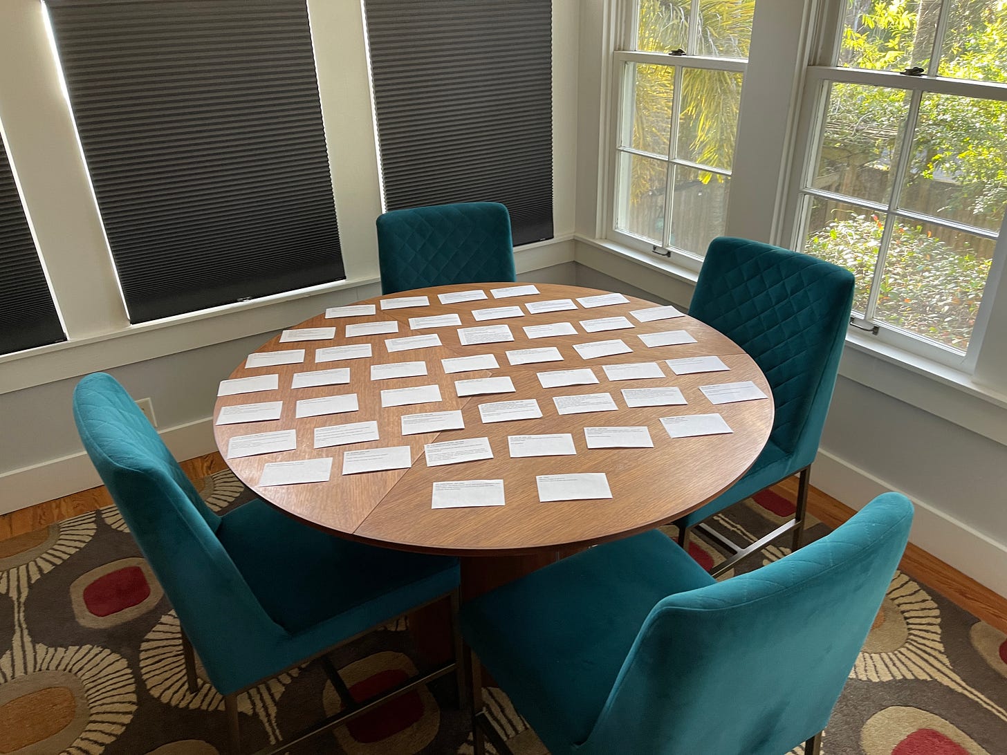 A table set neatly with typewritten notecards.