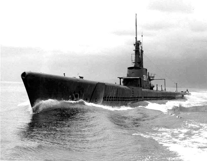 USS Archerfish moving across the open sea.