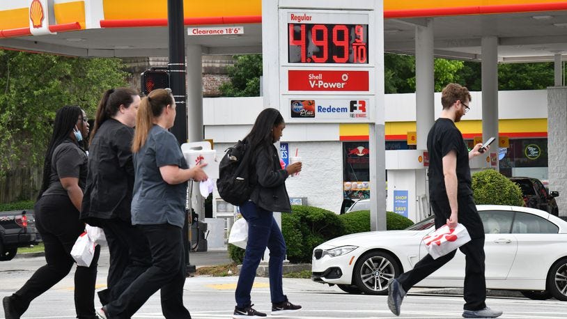 June 7, 2022 Atalnta - Lunch goers walk along a crosswalk near Shell gas station on Peachtree Road in Buckhead on Tuesday, June 6, 2022. Georgia gas prices hit new heights on Tuesday, according to AAA, with an average statewide cost of $4.33 for a gallon of regular unleaded fuel. That’s still well below the national average of $4.92 per gallon.(Hyosub Shin / Hyosub.Shin@ajc.com)
