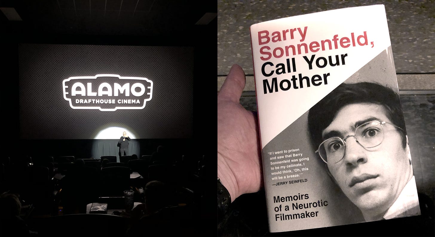 Montage of two photos. On the left, the tiny figure of director Barry Sonnenfeld stands in a spotlight at the front of a mostly empty movie theater, under an Alamo Drafthouse Cinema logo. On the right, a hand is holding a hardcover copy of "Barry Sonnenfeld, Call Your Mother: Memoirs of a Neurotic Filmmaker," with a headshot of a young, startled-looking Barry Sonnenfeld on the cover.