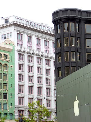 photo of a cityscape in San Francisco including the Apple logo on the Apple store