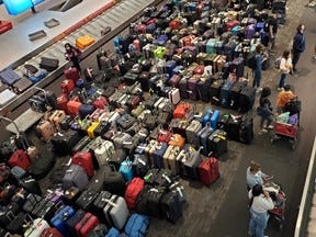 Airline passengers continue to report major delays at Pearson Airport in Toronto and mountains of luggage both on the tarmac and inside, as is seen here in this photo taken on Sunday, June 26, 2022.