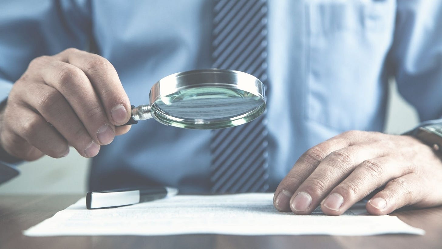 a man using a magnifying glass