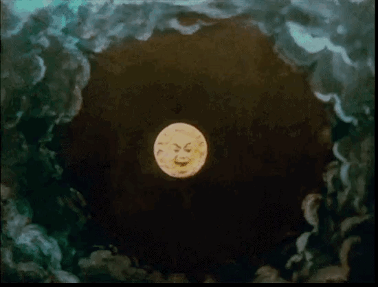 Gif of a rocket hitting the moon’s eyeball from a beautifully hand-colored print of “A Trip to the Moon.” 