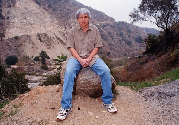 The urban theorist Mike Davis in the Angeles National Forest in 1999. Los Angeles, he wrote, &ldquo;has come to play the double role of utopia and dystopia for advanced capitalism.&rdquo;