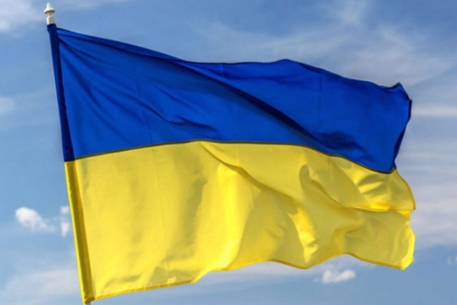Blue and yellow Ukrainian flag flying in the wind
