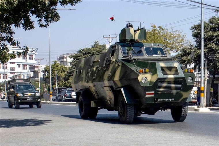 Image: Military vehicles are seen along a street in Mandalay on Feb. 2, 2021, as Myanmar's generals appeared in firm control a day after a surgical coup that saw democracy heroine Suu Kyi detained.