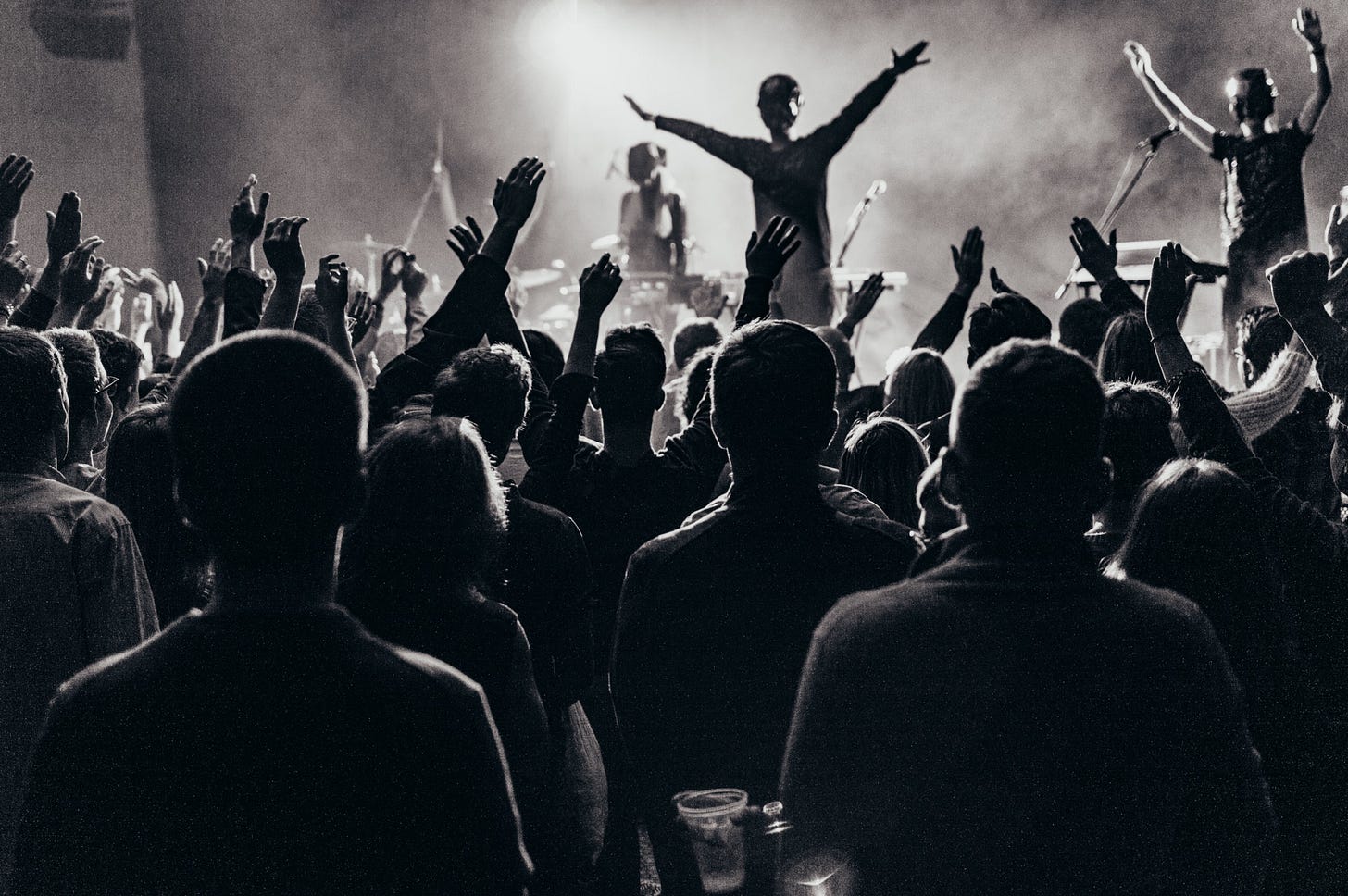 black and white image of an audience for poem by Larry G. Maguire titled “Audience”