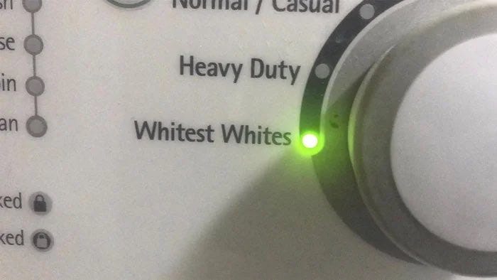 Washing machine controls with a dial set to “whitest whites”