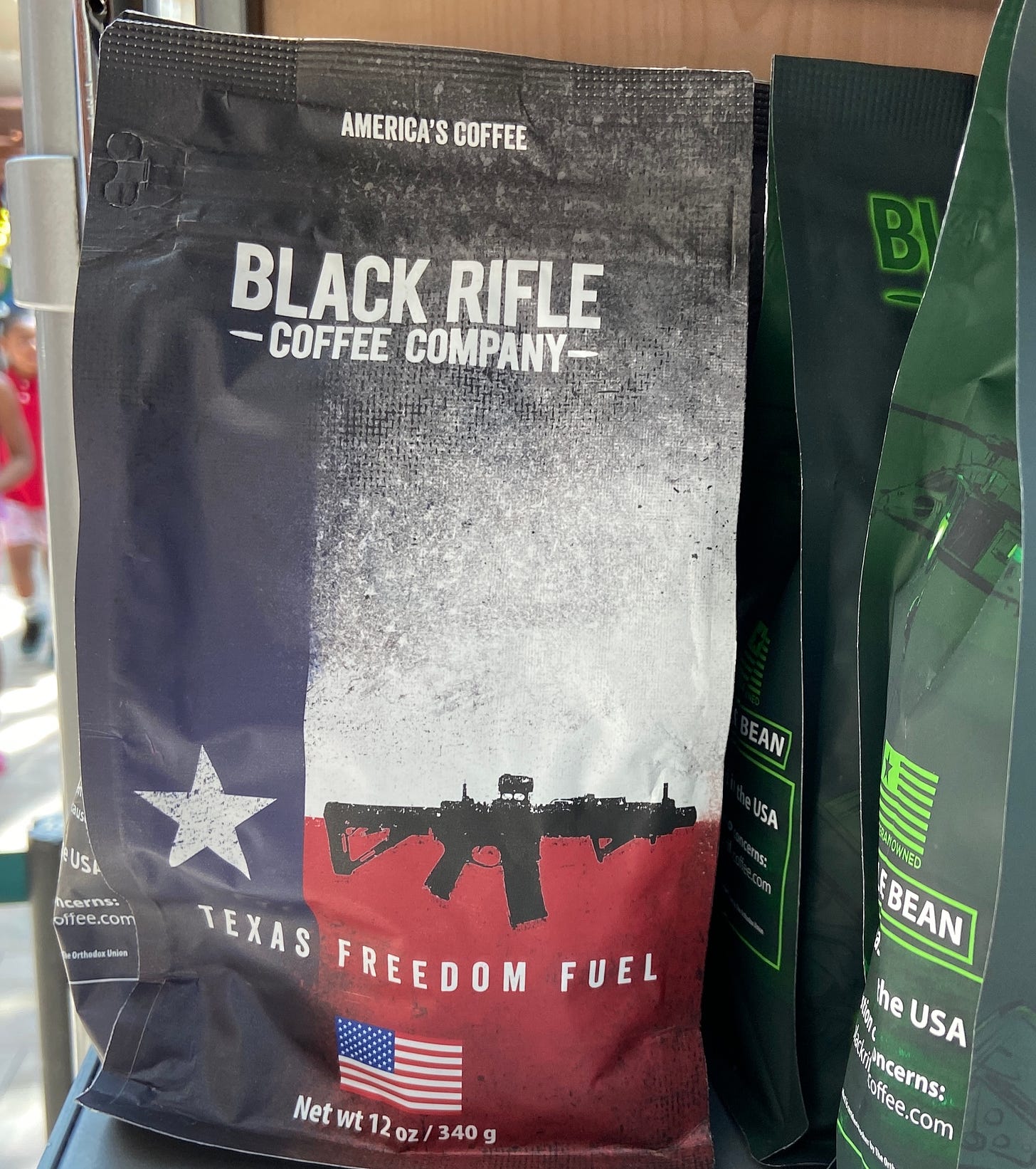 An image of a bag of coffee named "Texas Freedom Fuel" with a graphic of the Texas flag and an assault rifle.