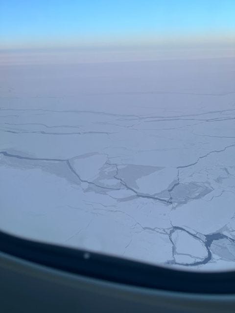 Ice covered landscape, taken from an airplane window.