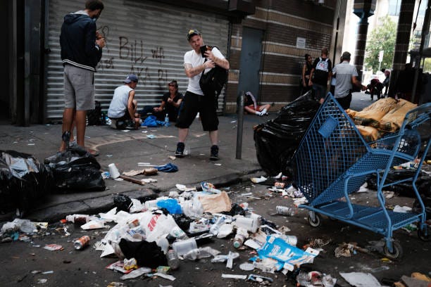 People gather in a street overtaken by heroin users in Kensington on July 19, 2021 in Philadelphia, Pennsylvania. According to data from the US...
