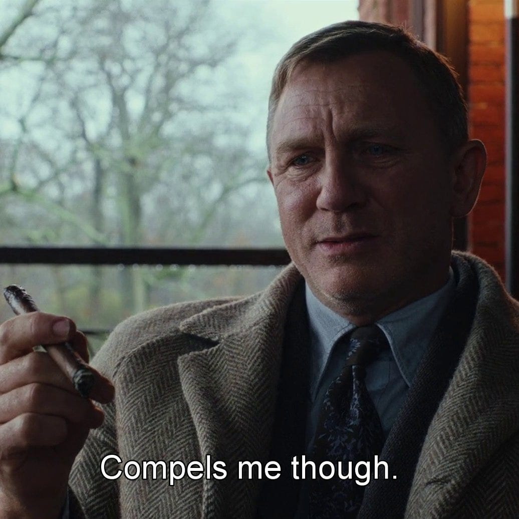 a close up of daniel craig, a white man, in front of a window showing a wintery day. his face is slightly perplexed, he is wearing a herringbone coat and holding a cigar aloft, and the caption says 'compels me though'