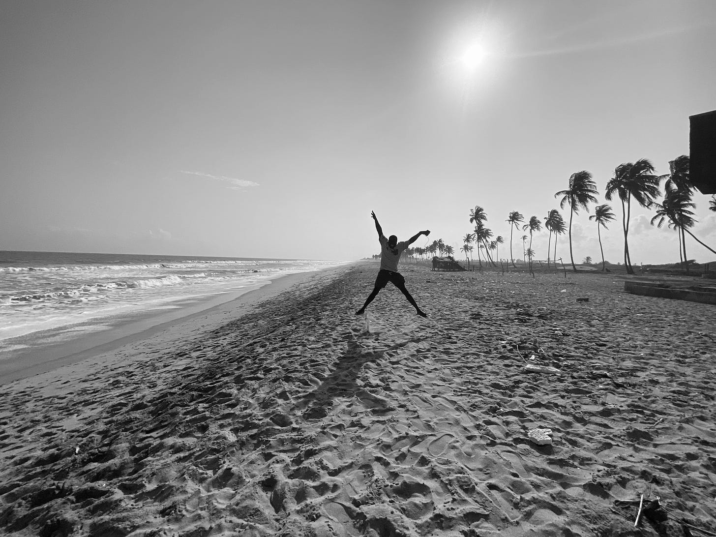 A black and white picture of a happy soul on a peaceful beach in Badary, Nigeria