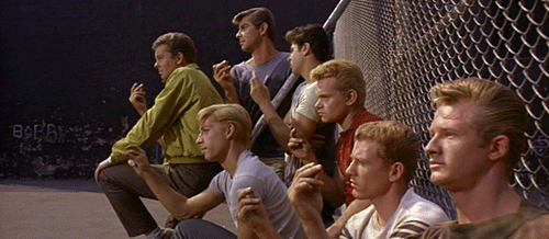 Animated gif of one of the gangs from West Side Story snapping their fingers and looking menacingly off-frame. (I don’t know which gang, as I’ve not seen the movie.)