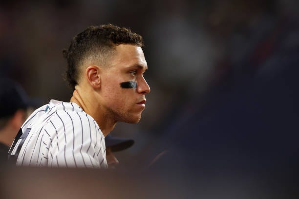 Aaron Judge of the New York Yankees looks on from the bench in the eighth inning against the Houston Astros at Yankee Stadium on June 24, 2022 in New...